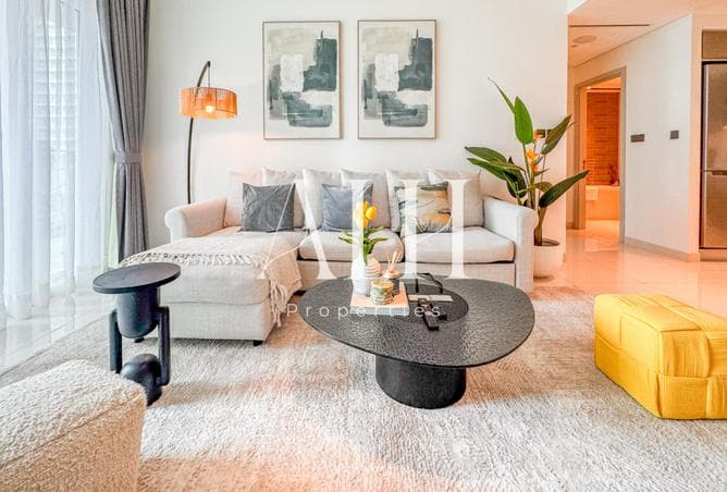 Living area with gallery wall and sectional sofa